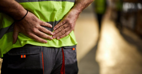 Worker holding his back